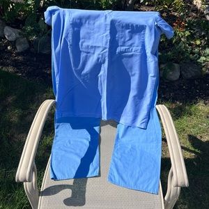 Lot of FIVE hospital scrub sets. Small bottom small top. Sold in as is condition